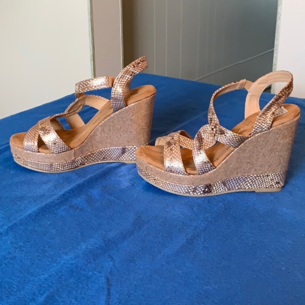 Very volatile gold snakeskin platform wedges